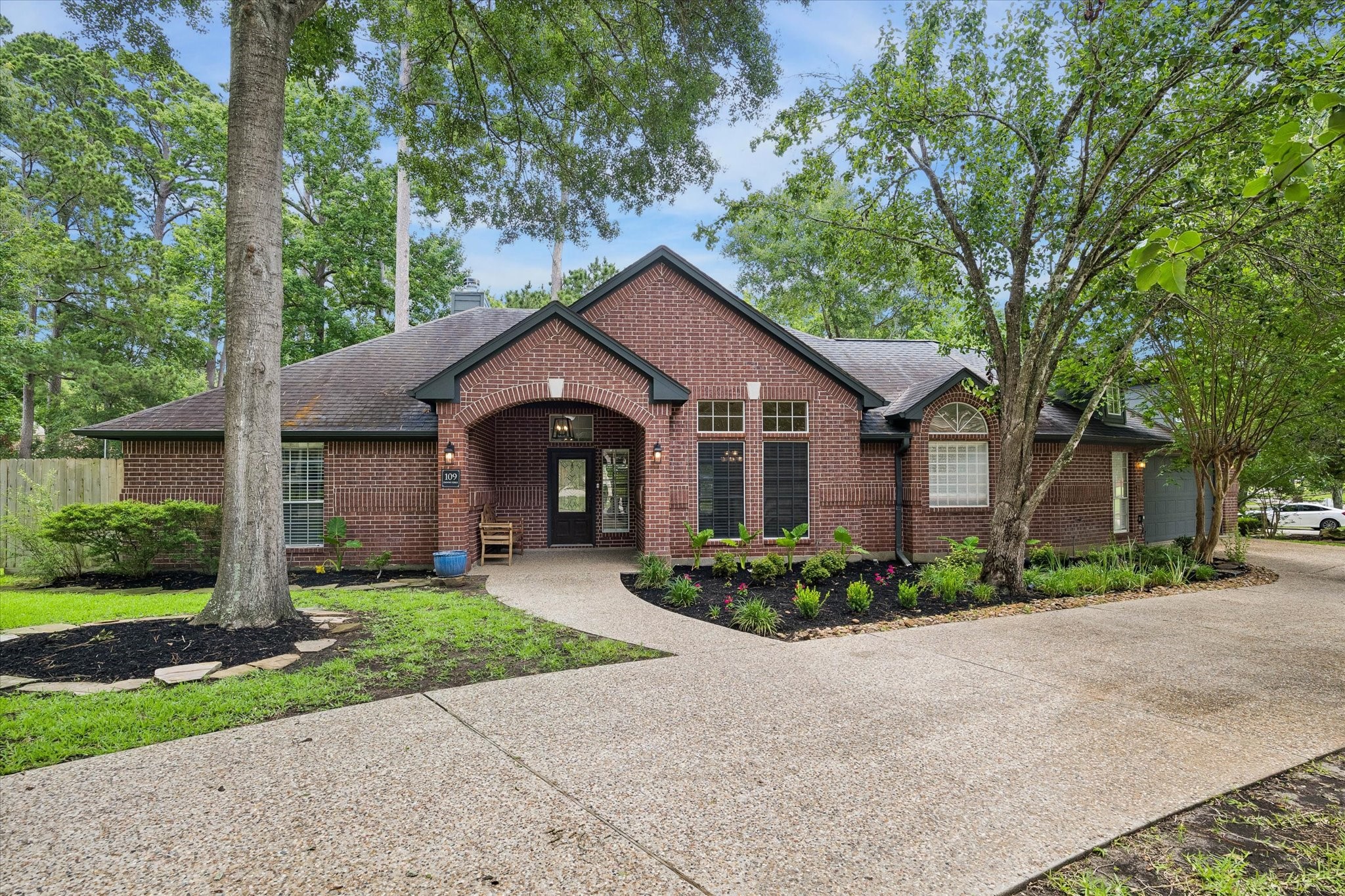 109 Dawns Edge Conroe, TX 77356 - Photo 1 of 24 a front view of a house with garden