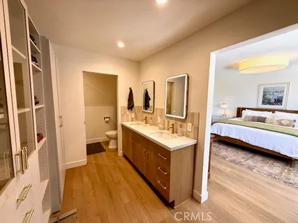 a spacious bathroom with a double vanity sink and a mirror