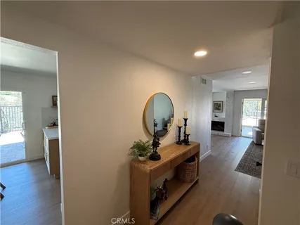 a view of living room with furniture and wooden floor