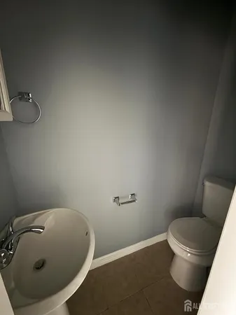 a bathroom with a toilet and a sink