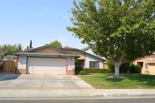 805 South Chesapeake Street Ridgecrest, CA 93555 - Photo 1 of 35 a front view of a house with a garden