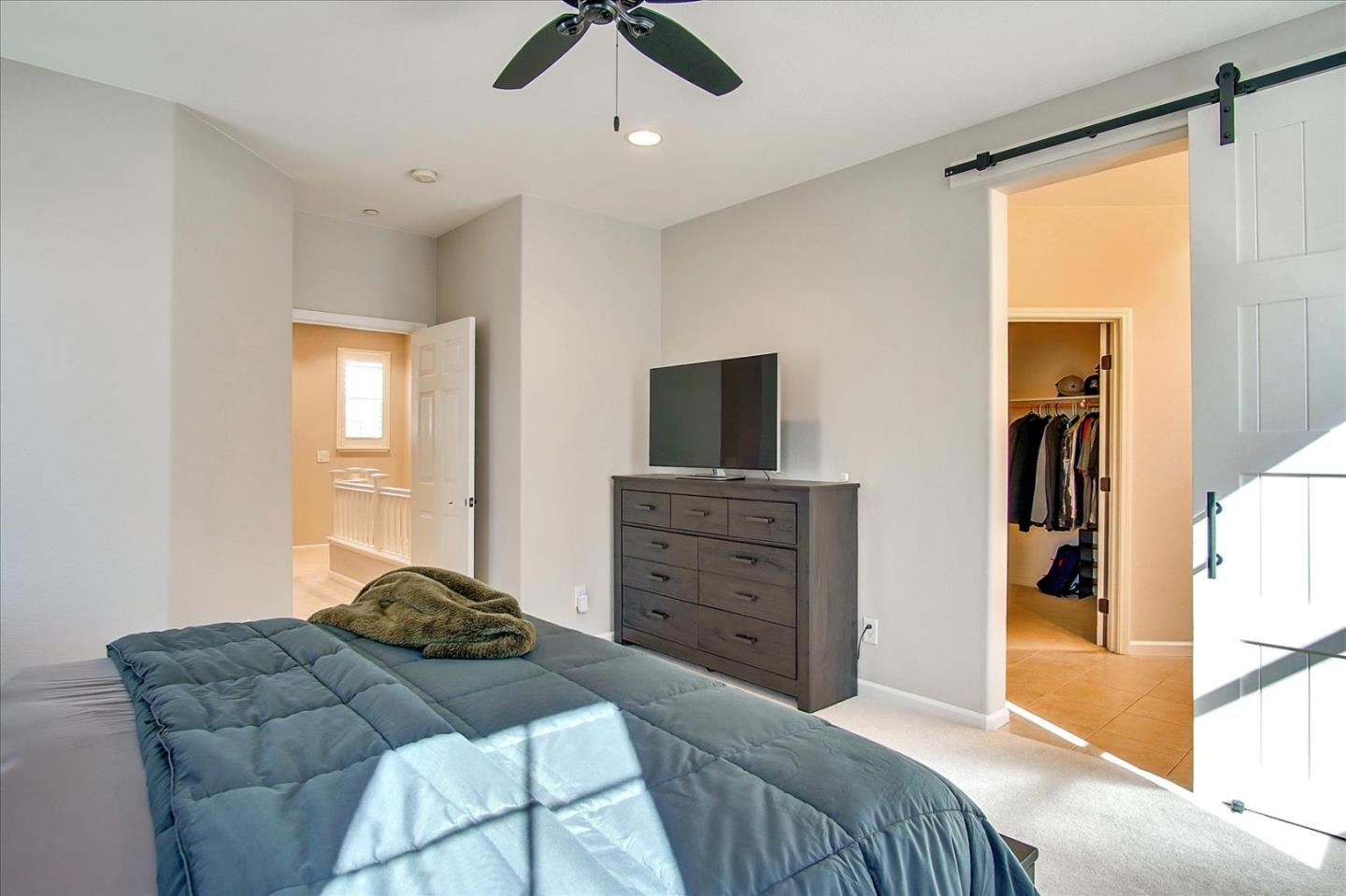 758 Tennyson Drive Gilroy, CA 95020 - Photo 21 of 39 a bedroom with a bed and a television in it