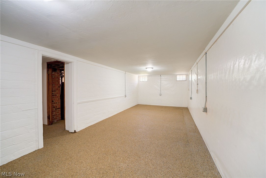 25819 Center Ridge Road Westlake, OH 44145 - Photo 30 of 45 Basement right off the stairs, nature stone flooring