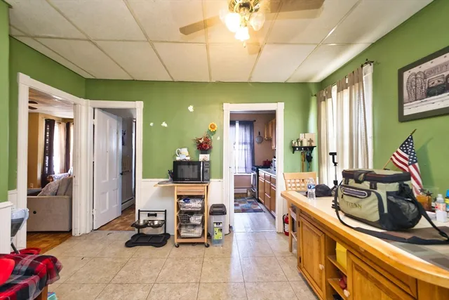 a view of a large kitchen with furniture and large windows