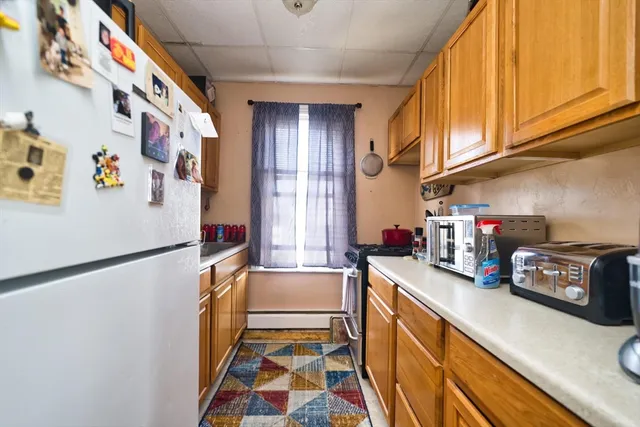 a kitchen with stainless steel appliances a refrigerator and a sink