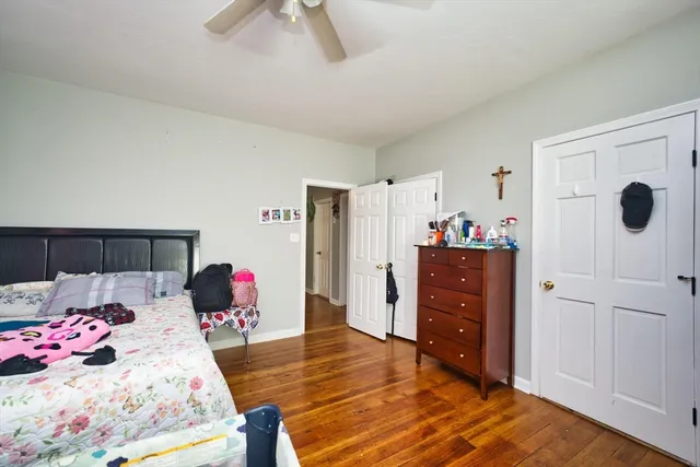 a bedroom with a bed and a dresser
