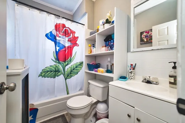 a room with a refrigerator and a sink