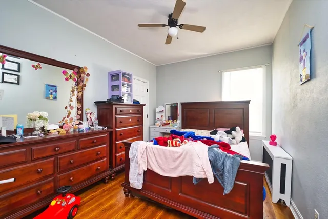 a bedroom with a bed and furniture