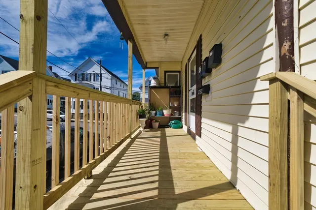 a view of a balcony with wooden floor