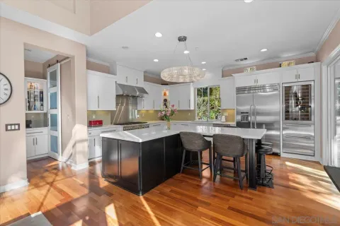 a kitchen with a table and chairs in it
