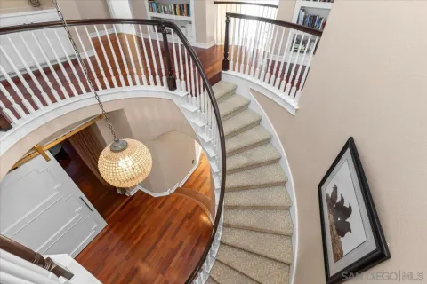 a view of entryway with wooden floor