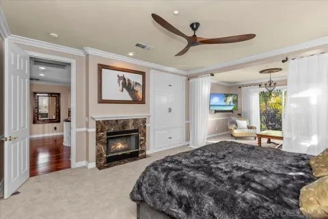 a bedroom with a bed and a fireplace