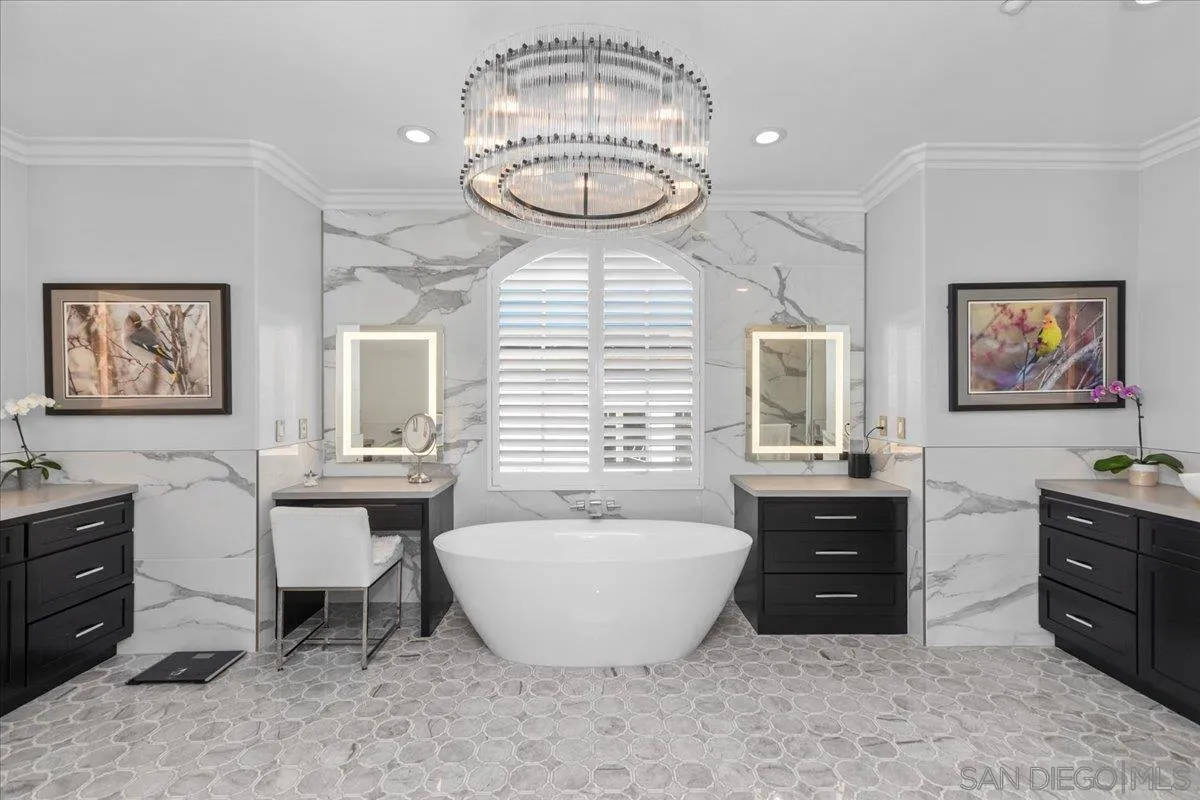 515 Verbena Court Encinitas, CA 92024 - Photo 27 of 42 a spacious bathroom with a granite countertop sink and a mirror