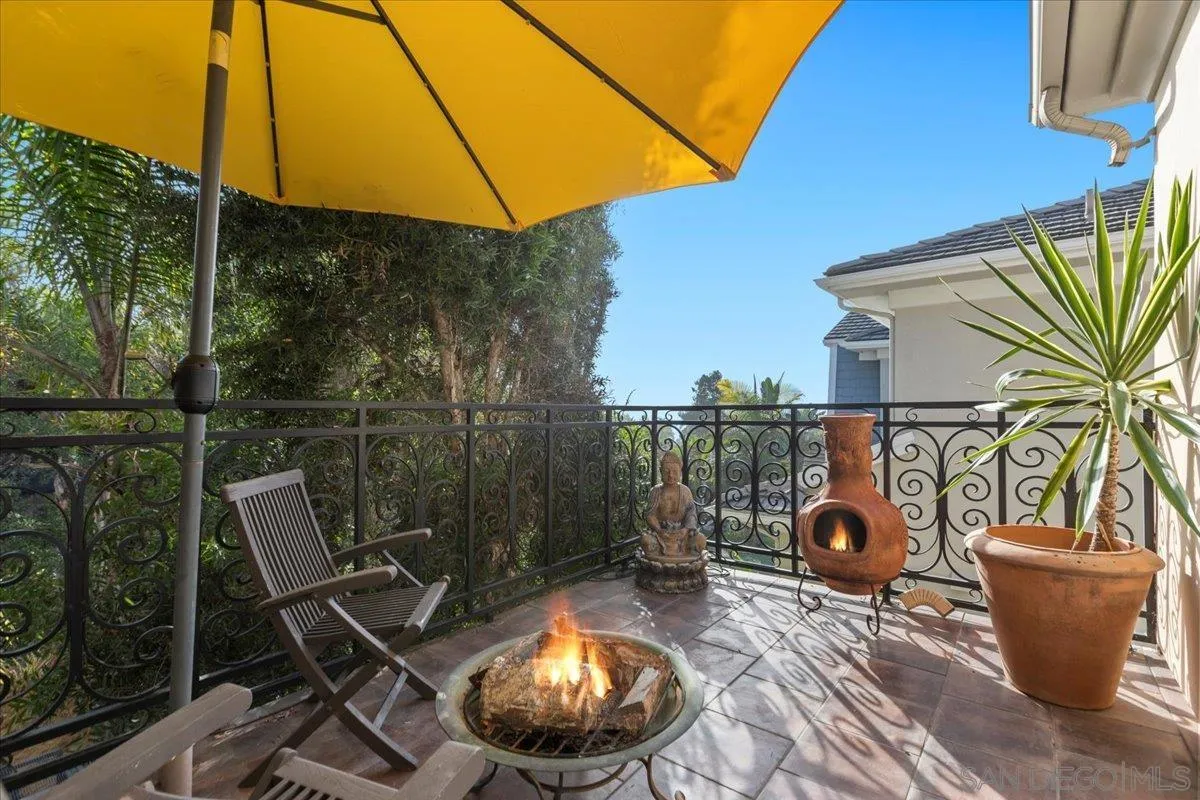 515 Verbena Court Encinitas, CA 92024 - Photo 31 of 42 a backyard of a house with table and chairs