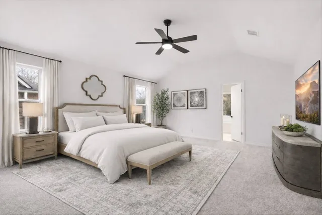 an empty room with a window and a ceiling fan