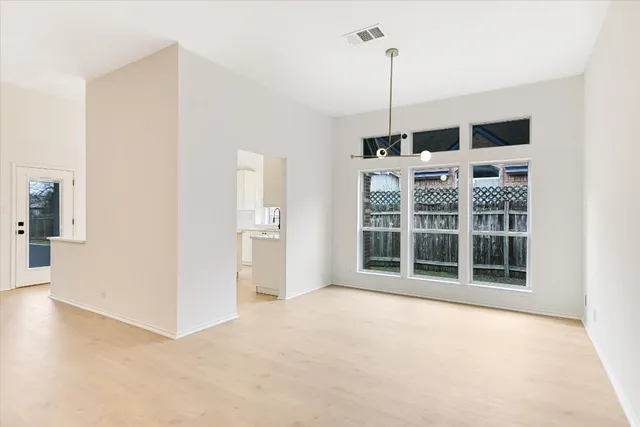 a kitchen with stainless steel appliances a refrigerator sink and cabinets