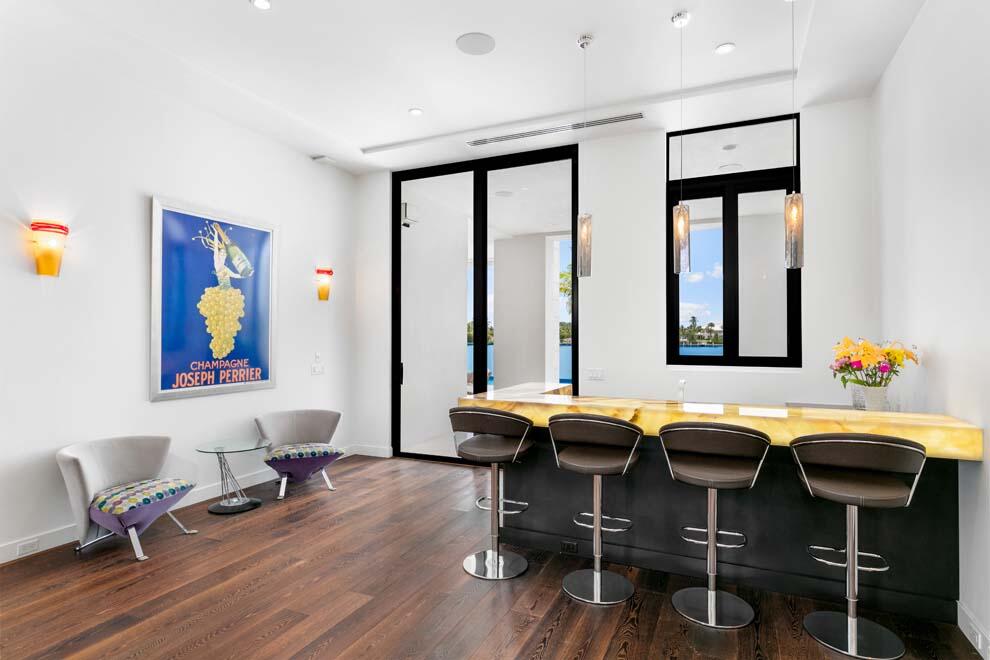 1540 Paslay Place Manalapan, FL 33462 - Photo 12 of 40 a view of a dining room with furniture window and wooden floor