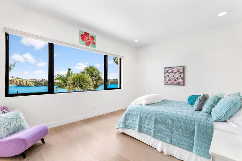 1540 Paslay Place Manalapan, FL 33462 - Photo 24 of 40 a bedroom with furniture and a window