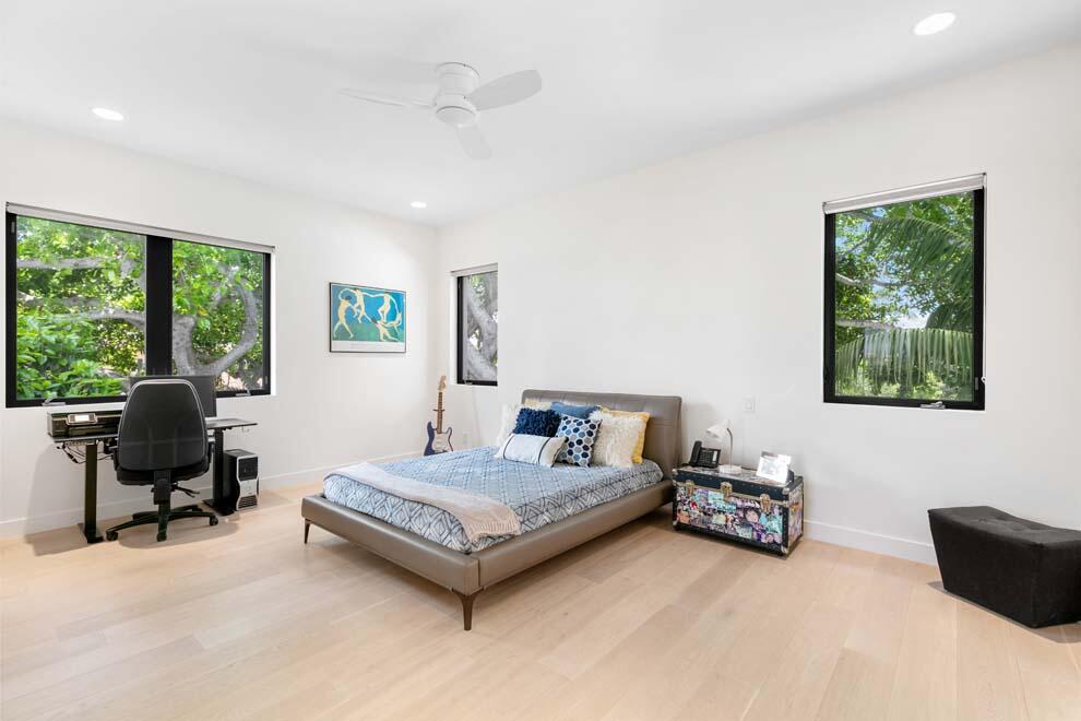 1540 Paslay Place Manalapan, FL 33462 - Photo 26 of 40 a bedroom with bed couch and a window