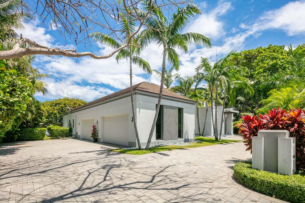 1540 Paslay Place Manalapan, FL 33462 - Photo 4 of 40 a white house with a yard and a large tree