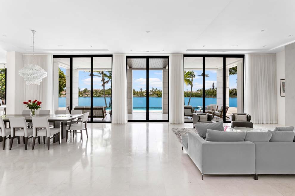 1540 Paslay Place Manalapan, FL 33462 - Photo 5 of 40 a living room with furniture and large windows