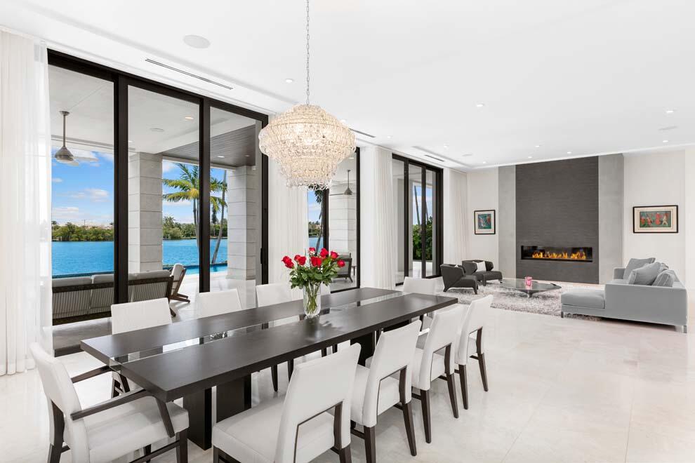 1540 Paslay Place Manalapan, FL 33462 - Photo 9 of 40 a view of a dining room with furniture window and wooden floor
