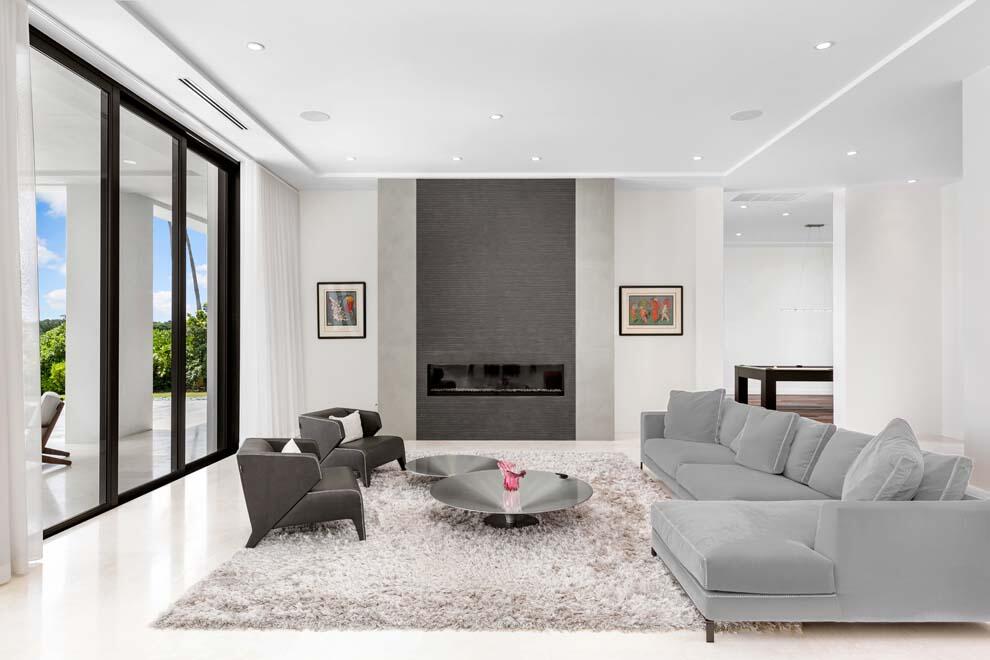 1540 Paslay Place Manalapan, FL 33462 - Photo 10 of 40 a living room with furniture and a fireplace