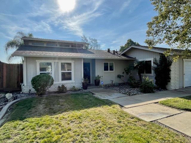 2212 Lavon Lane Ceres, CA 95307 - Photo 1 of 14 a front view of a house with garden