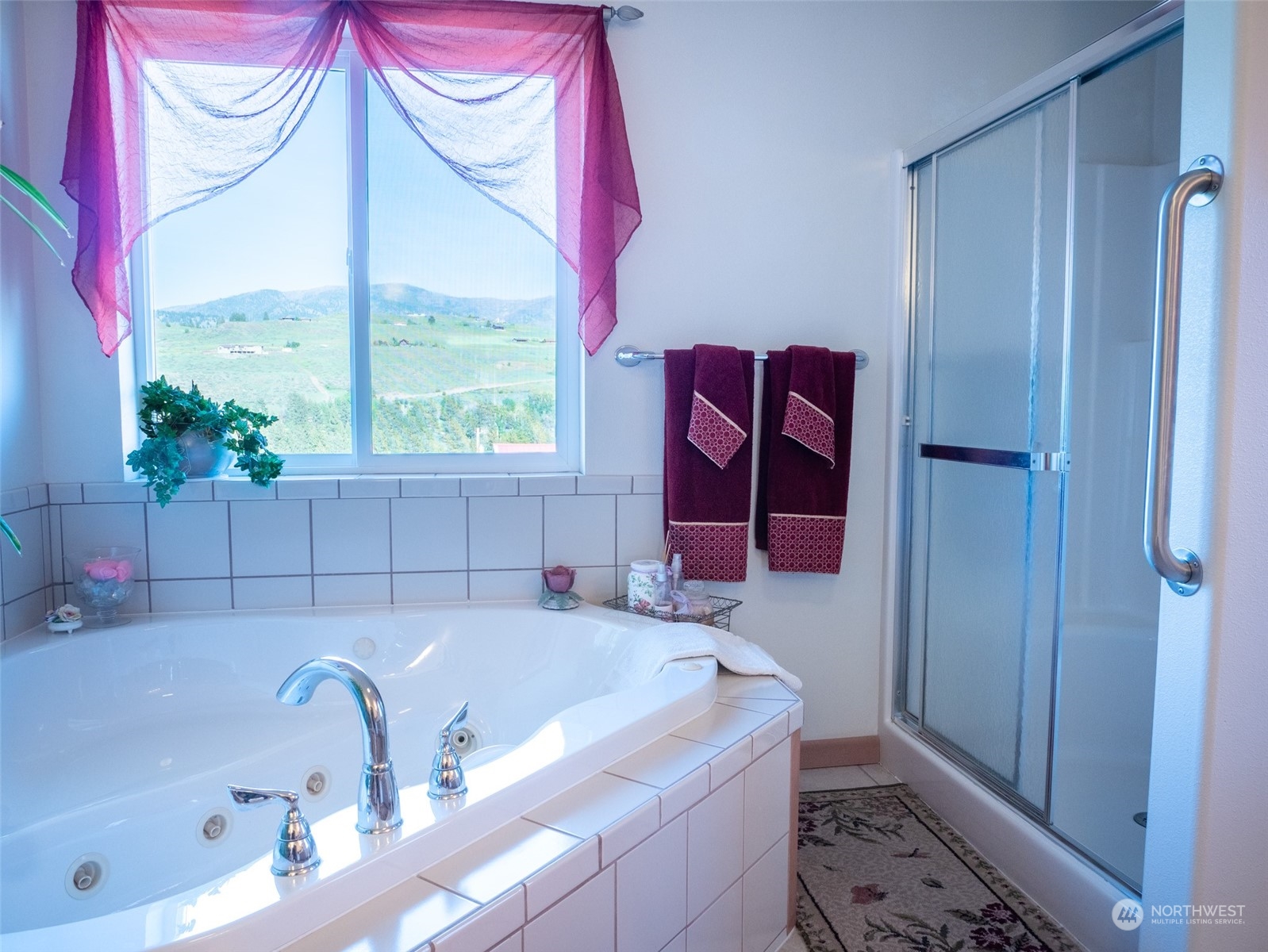 22 Rhinehart Road Winthrop, WA 98862 - Photo 11 of 23 a bathroom with a tub sink and a window