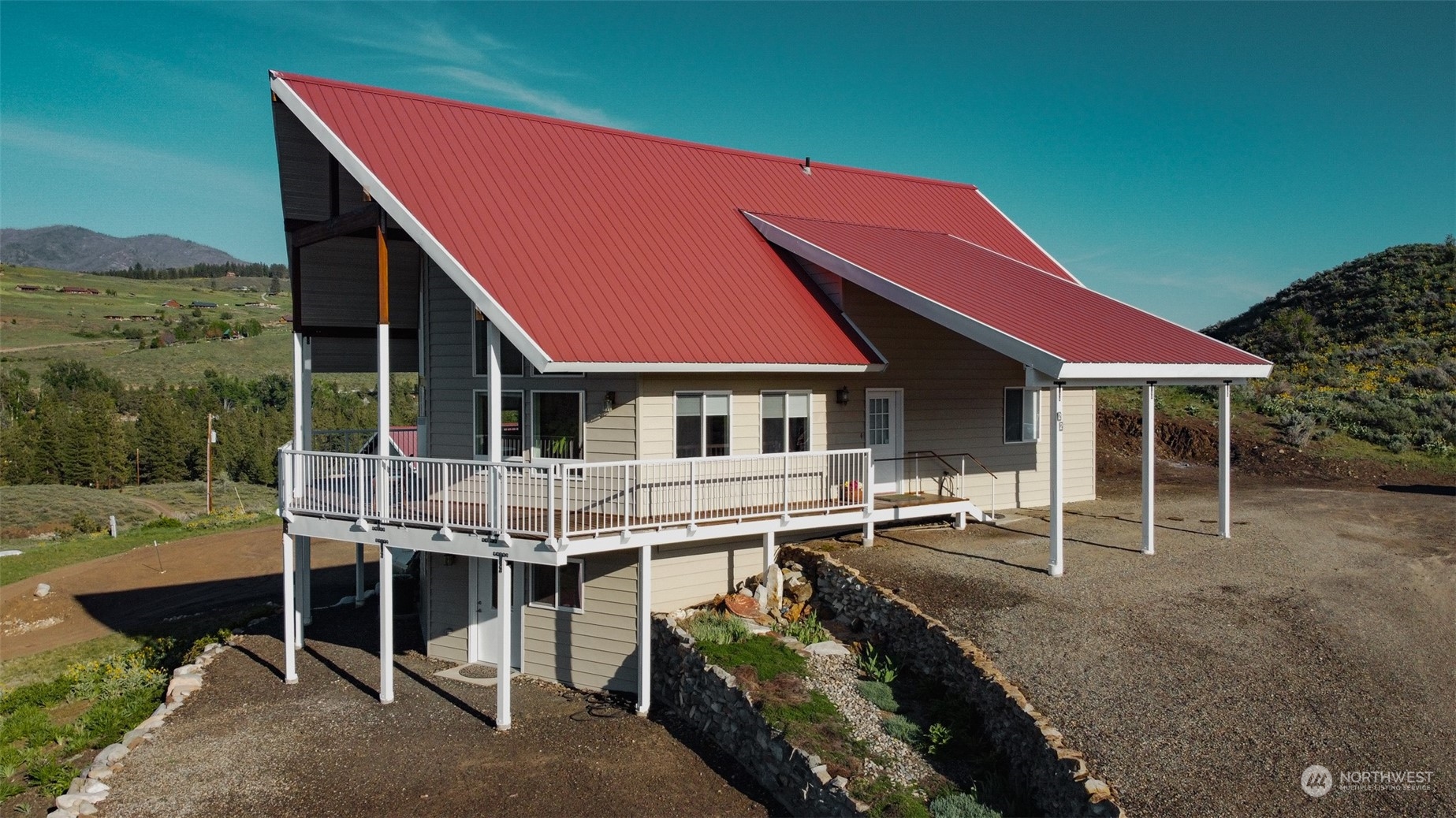 22 Rhinehart Road Winthrop, WA 98862 - Photo 3 of 23 a front view of a house with a porch