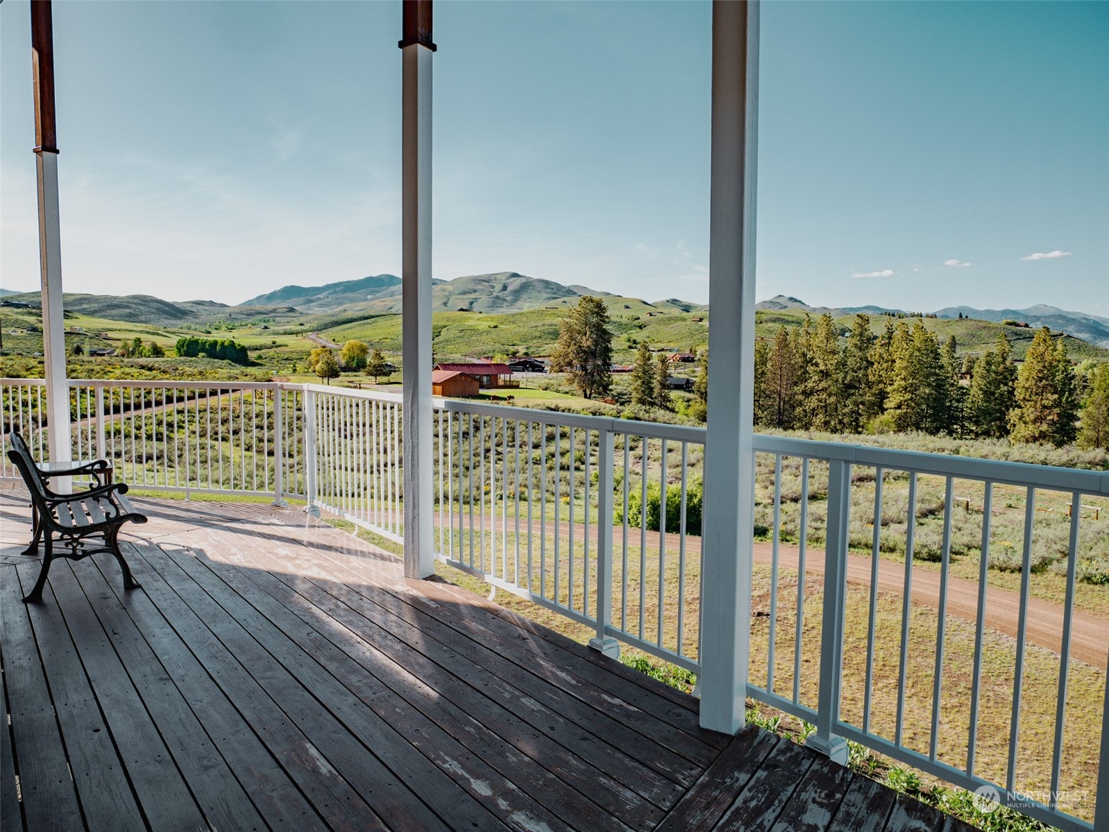 22 Rhinehart Road Winthrop, WA 98862 - Photo 9 of 23 a view of a balcony with lake view and wooden floor