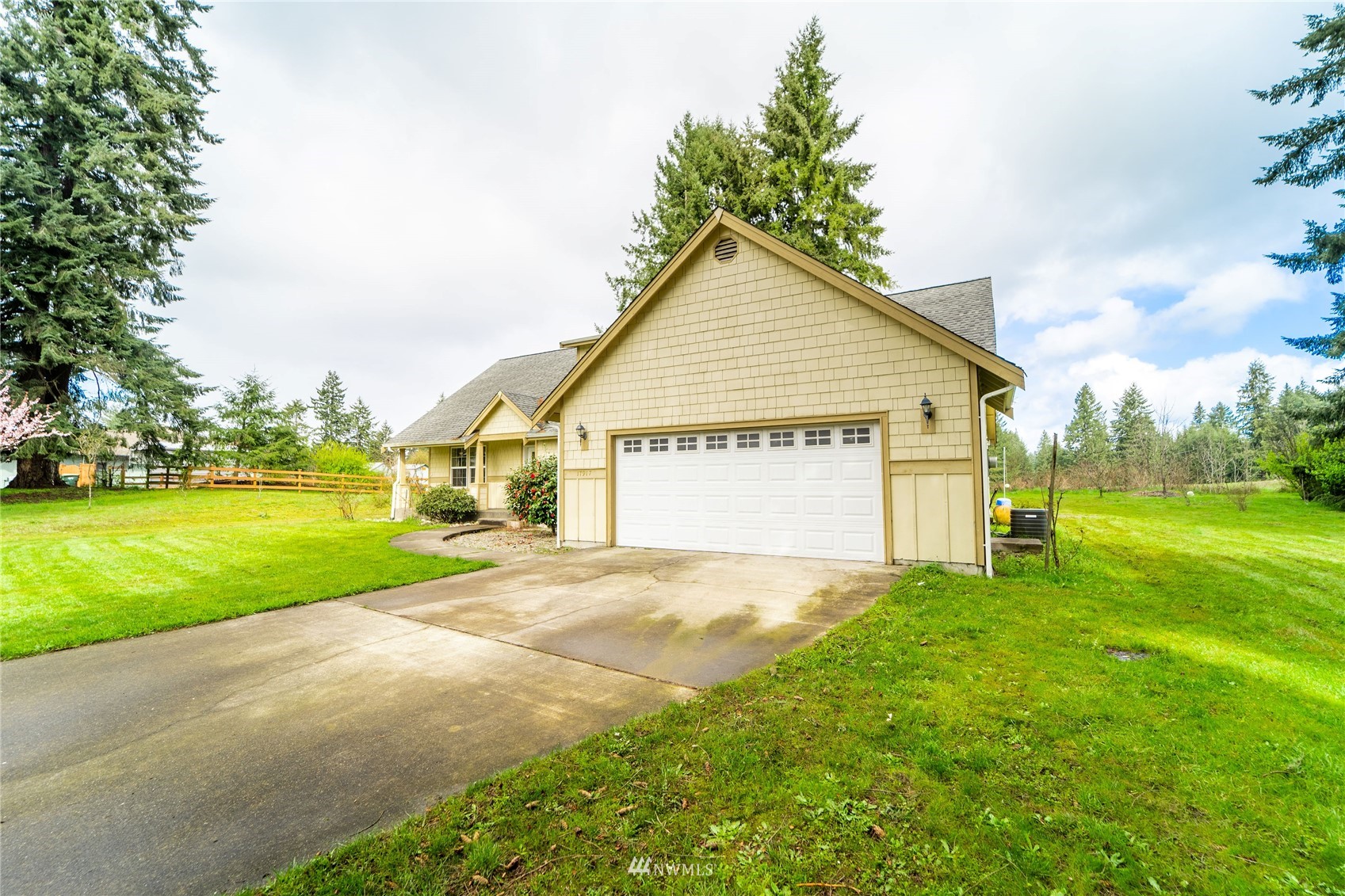 17917 Daryl Lane Southwest Rochester, WA 98579 - Photo 26 of 28 a view of a house with a yard and garage