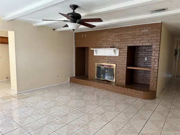 a kitchen with wooden cabinets and a stove top oven