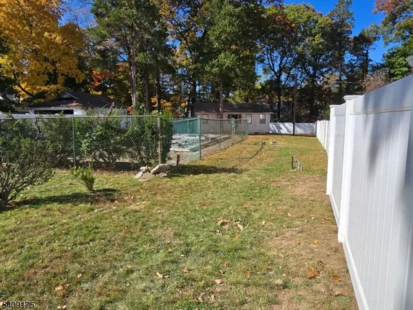 a view of yard with swimming pool