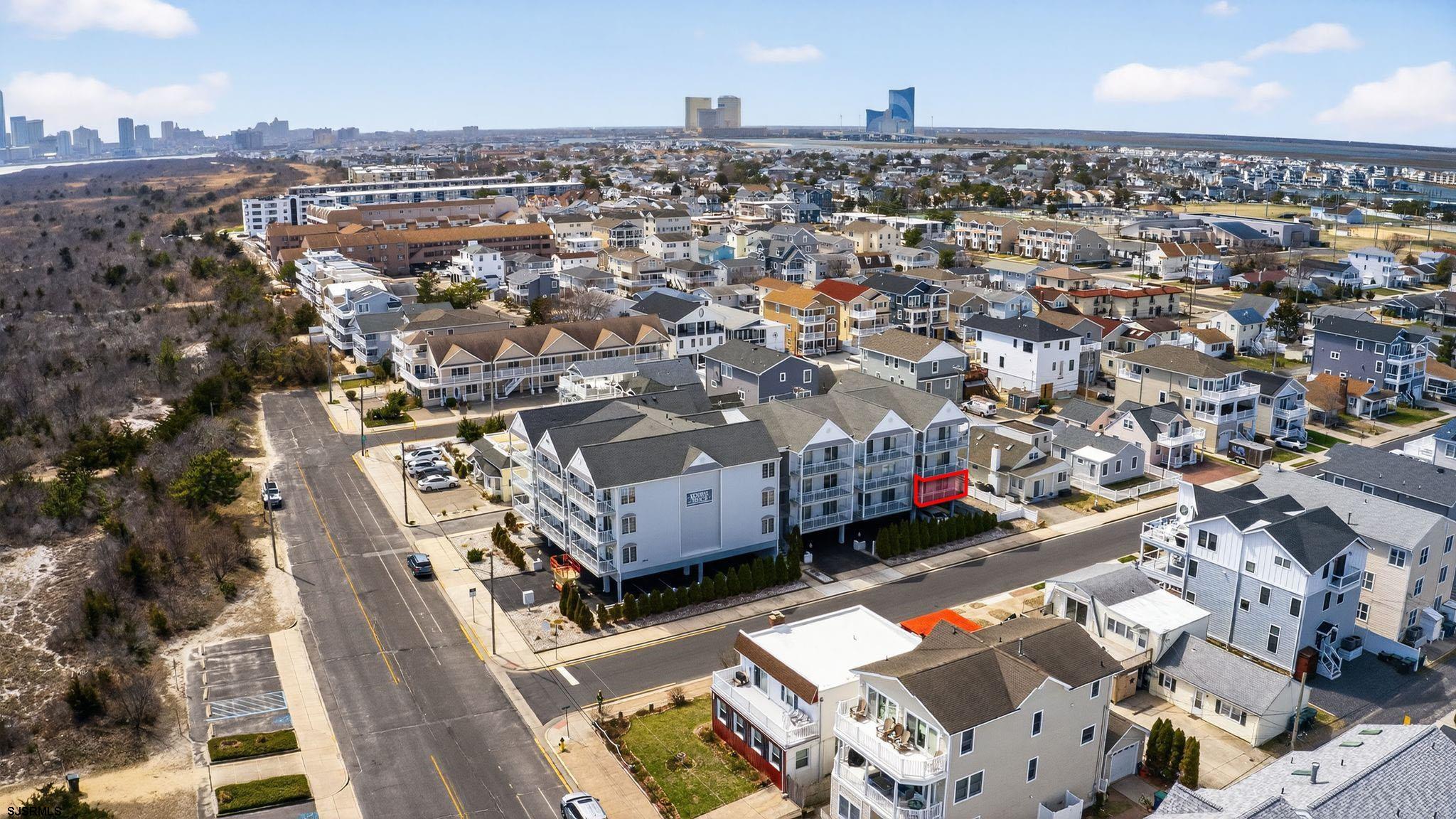 3901 Ocean Avenue, Unit 6 Brigantine, NJ 08203 - Photo 20 of 24 an aerial view of a house with a yard lake and city view