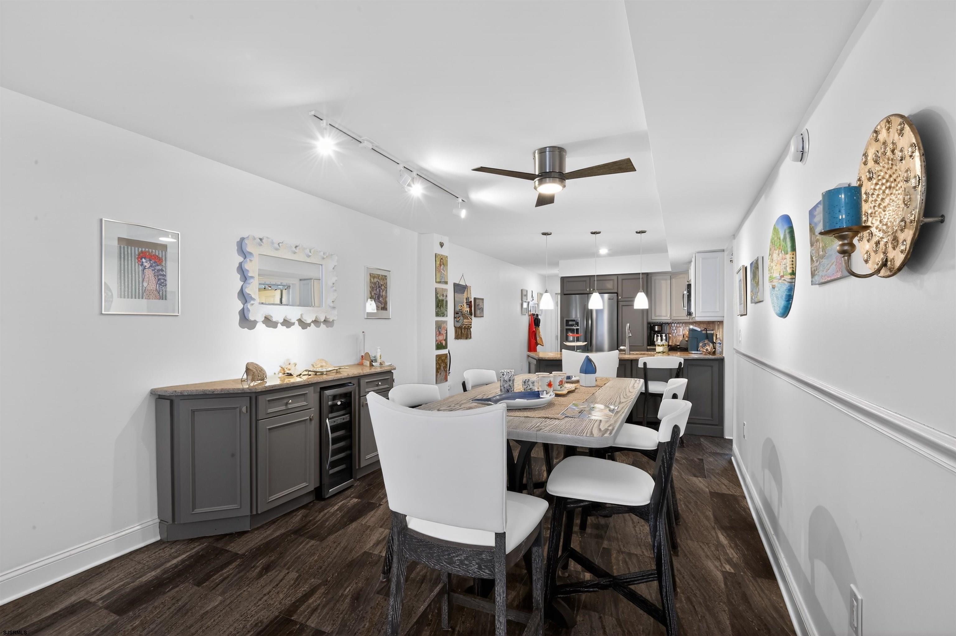 3901 Ocean Avenue, Unit 6 Brigantine, NJ 08203 - Photo 5 of 24 a view of a dining room with furniture and a chandelier