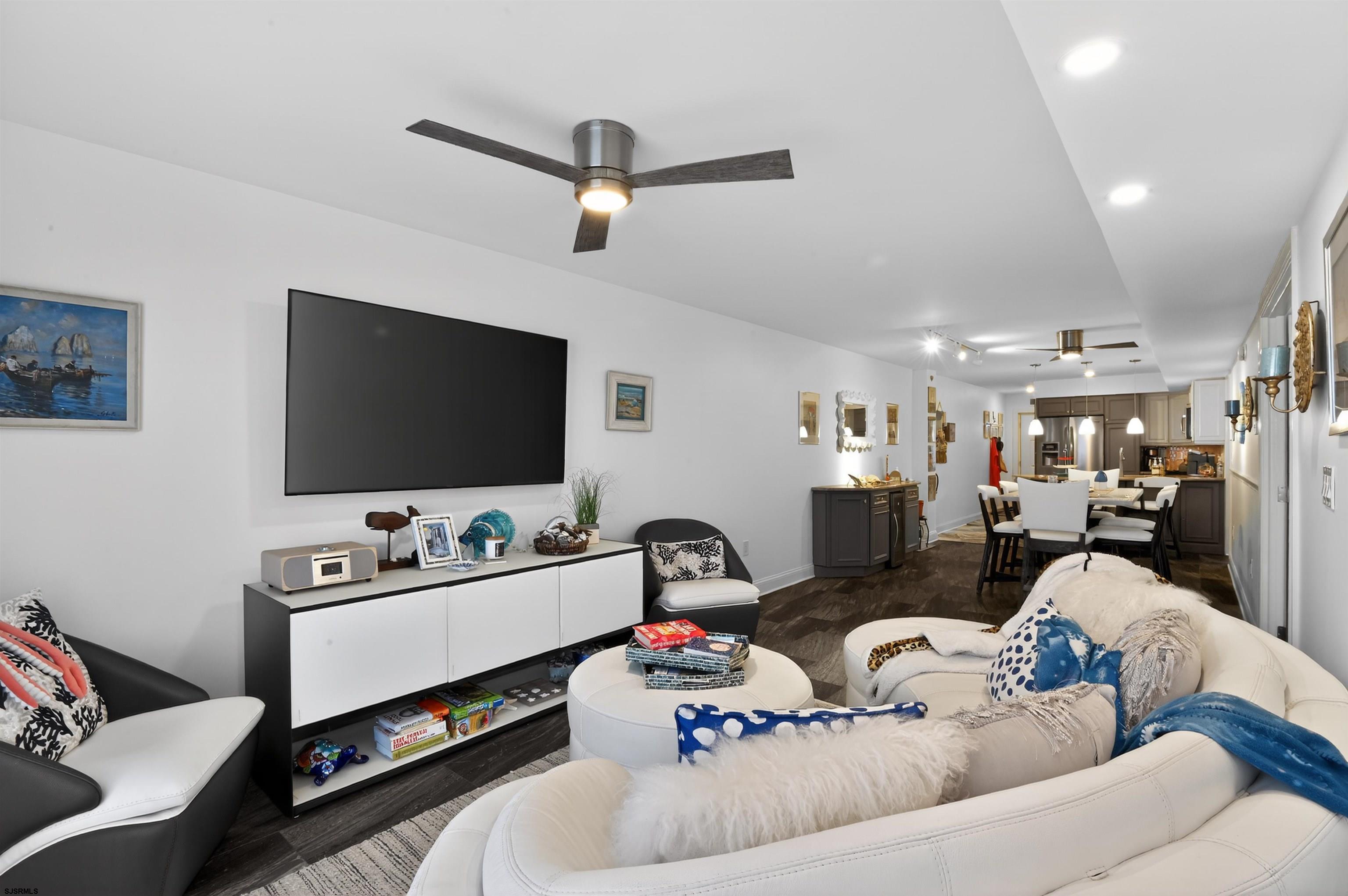 3901 Ocean Avenue, Unit 6 Brigantine, NJ 08203 - Photo 7 of 24 a living room with furniture and a flat screen tv