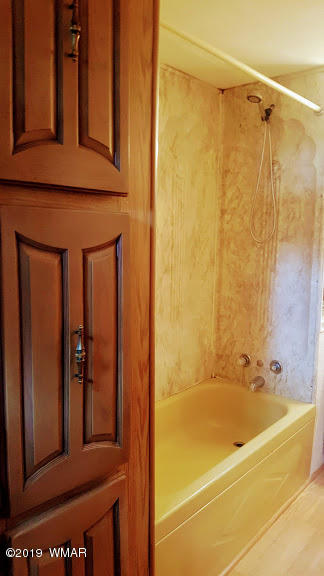 4381 East Blue Ridge Loop, Unit 3 Pinetop, AZ 85935 - Photo 13 of 16 a bathroom with a bathtub and shower