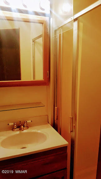 4381 East Blue Ridge Loop, Unit 3 Pinetop, AZ 85935 - Photo 16 of 16 a bathroom with a sink