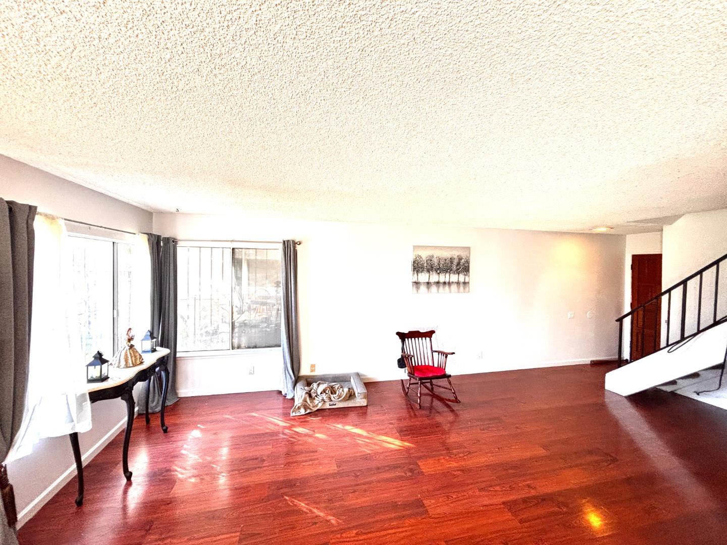 1752 Duffy Way San Jose, CA 95116 - Photo 5 of 14 a living room with furniture and a wooden floor