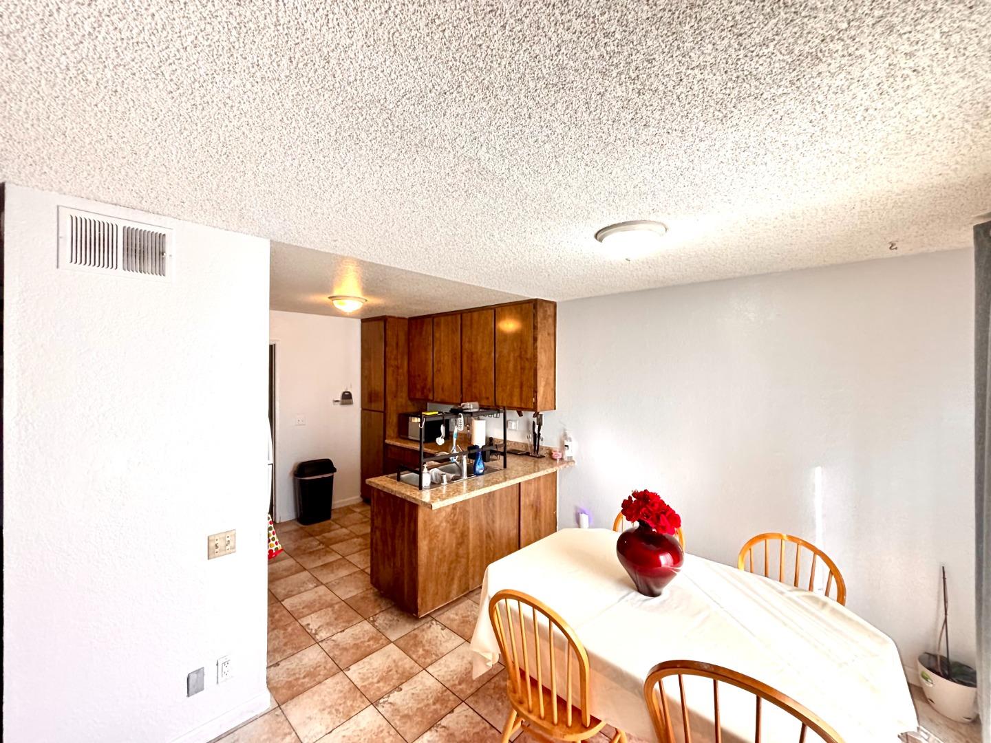 1752 Duffy Way San Jose, CA 95116 - Photo 6 of 14 a living room with furniture and a flat screen tv