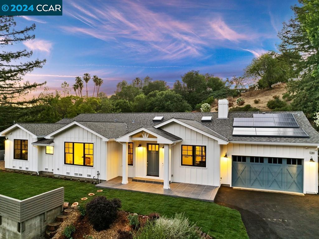 a view of multiple houses with a yard