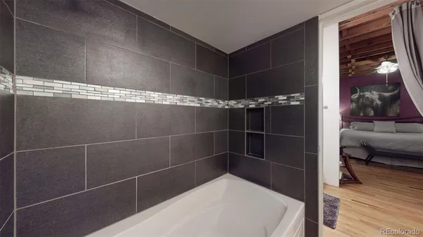 a bathroom with a bathtub and a shower