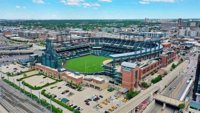 an aerial view of a city with lawn chairs