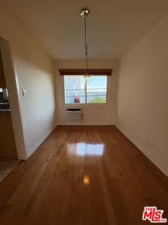 an empty room with a empty space and window