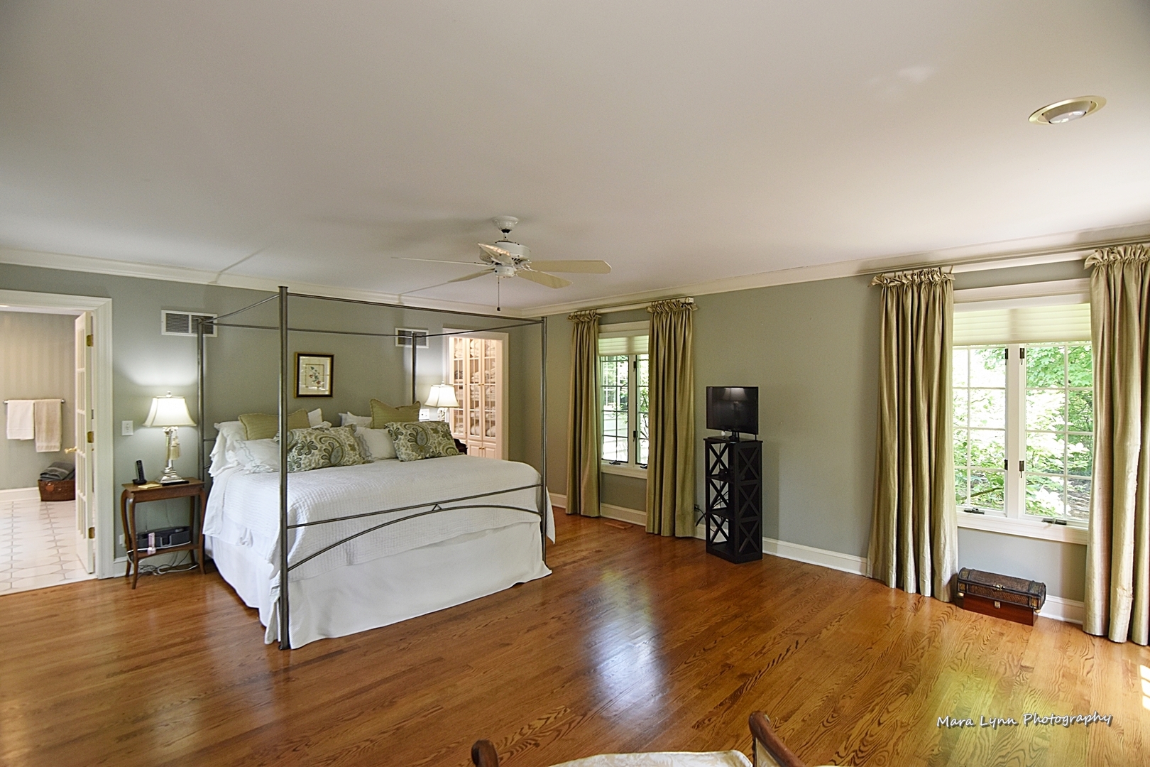 33W981 Army Trail Road Wayne, IL 60184 - Photo 25 of 71 a bedroom with a large bed and wooden floor