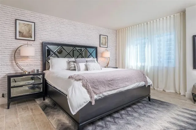 a bathroom with a sink a bathtub and a mirror