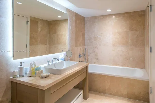 a bedroom with a bed and a television