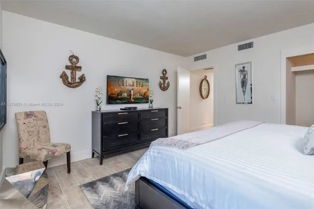 a view of a door and chair in the balcony