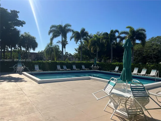 a view of swimming pool with patio